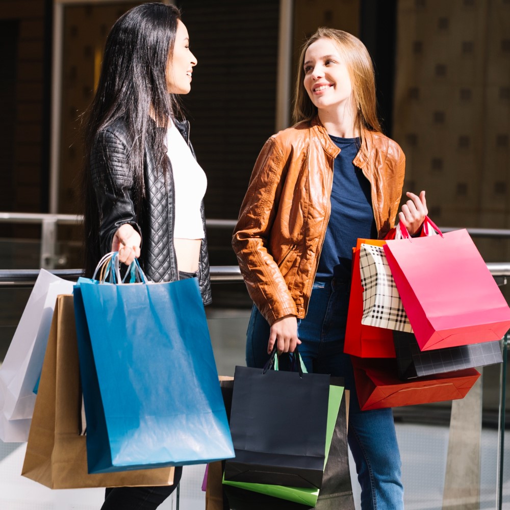 women holding shopping bags