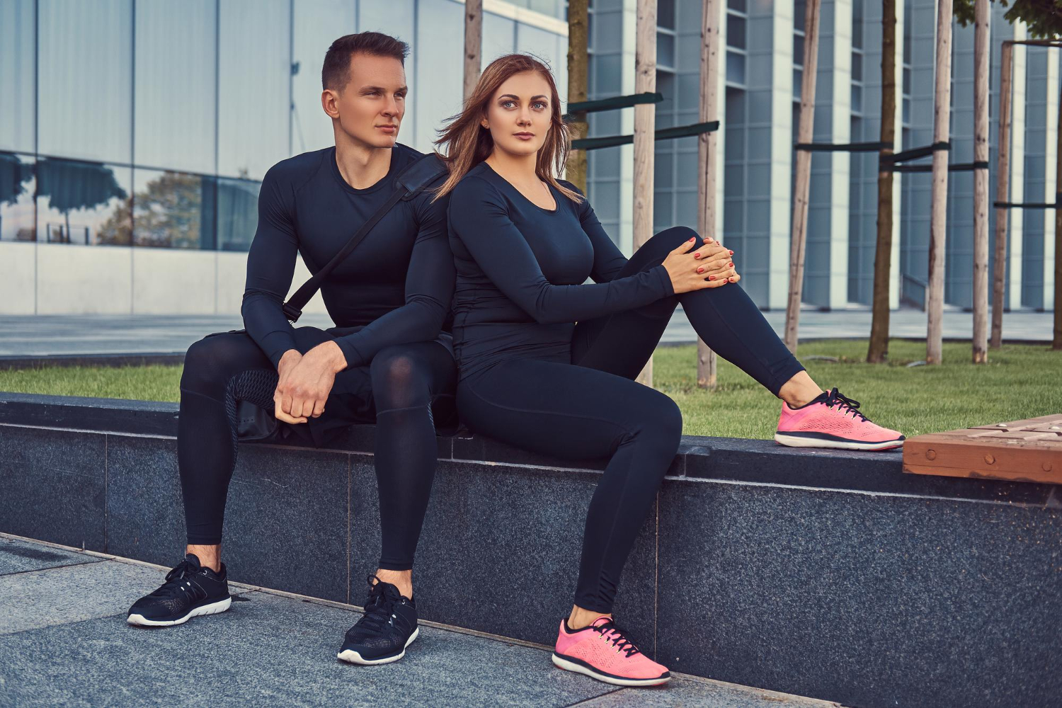 woman and man wearing tracksuits